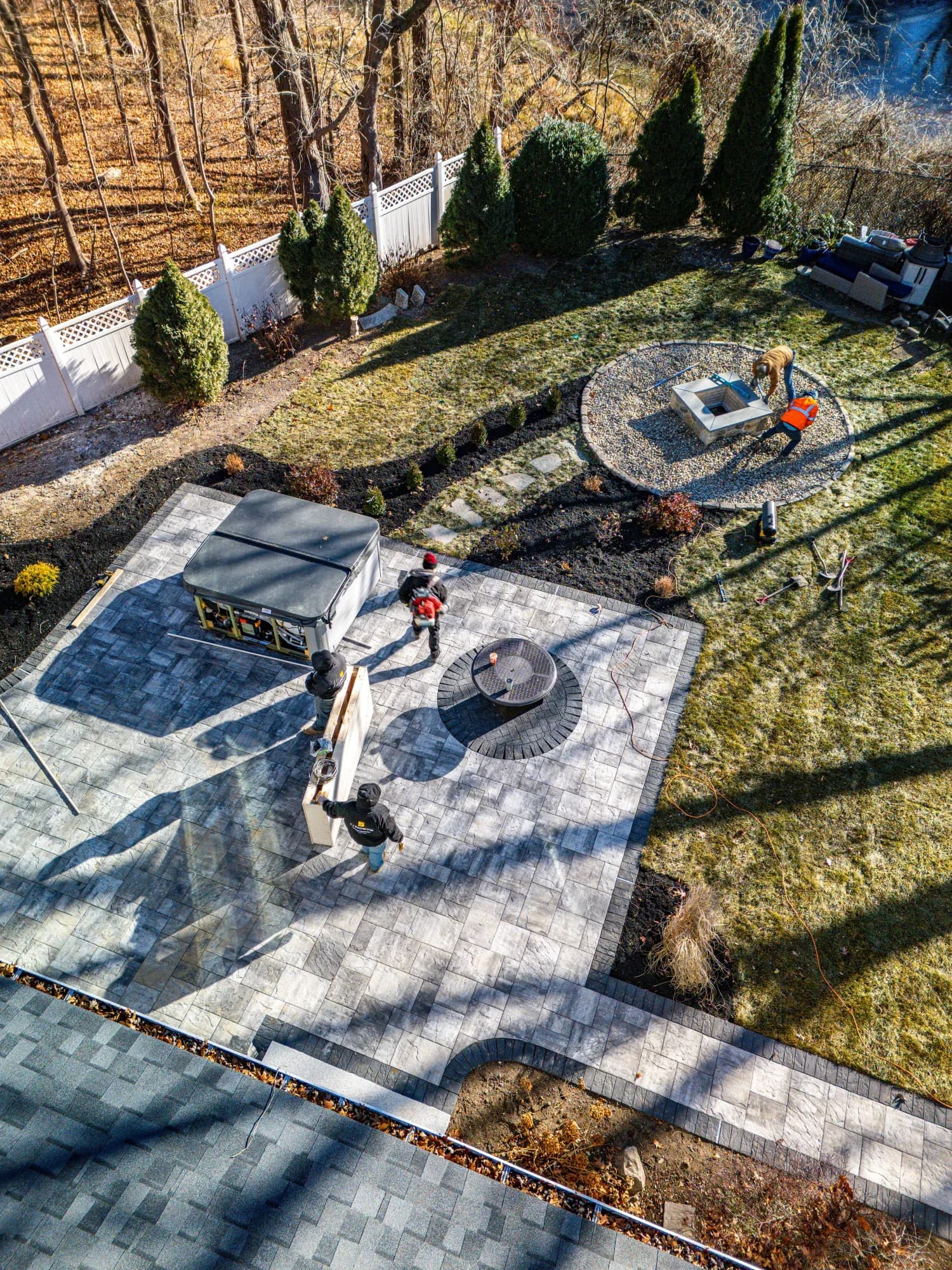 Construction progress: finishing work around the Westwood patio, spa, and fire-pit garden.