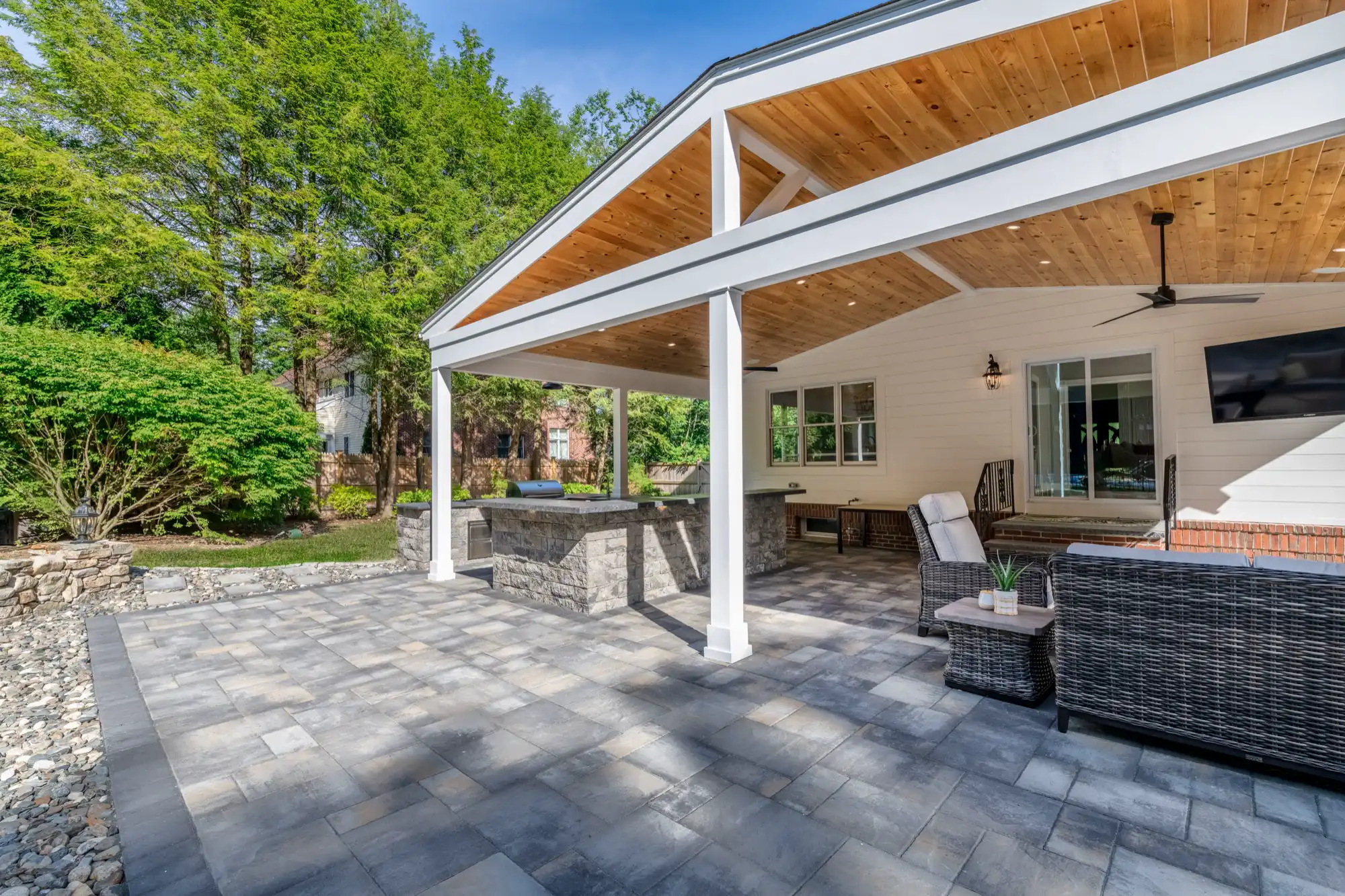 Open paver terrace in front of the pavilion kitchen and lounge.