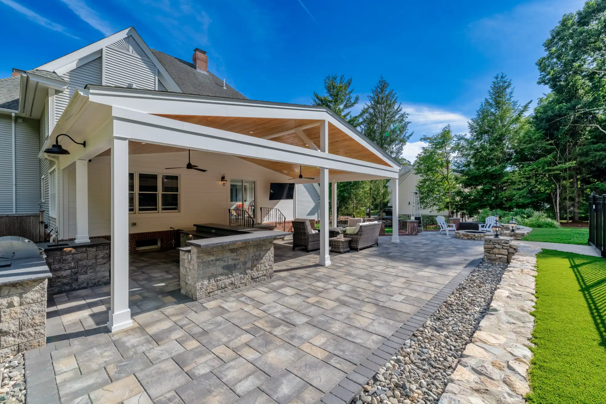 Pavilion kitchen and lounge viewed from the open patio beside the house.